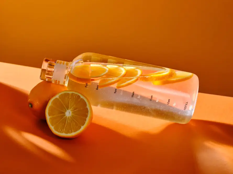 Lemon Bottle fat dissolving solution vial with a sliced lemon